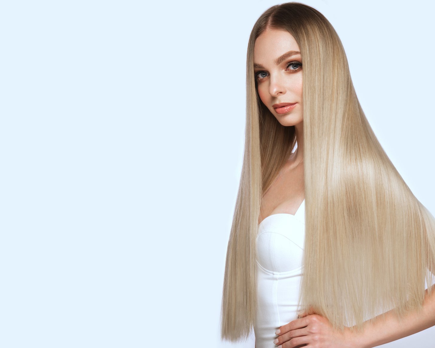 Beautiful blond girl with a perfectly smooth hair, and class